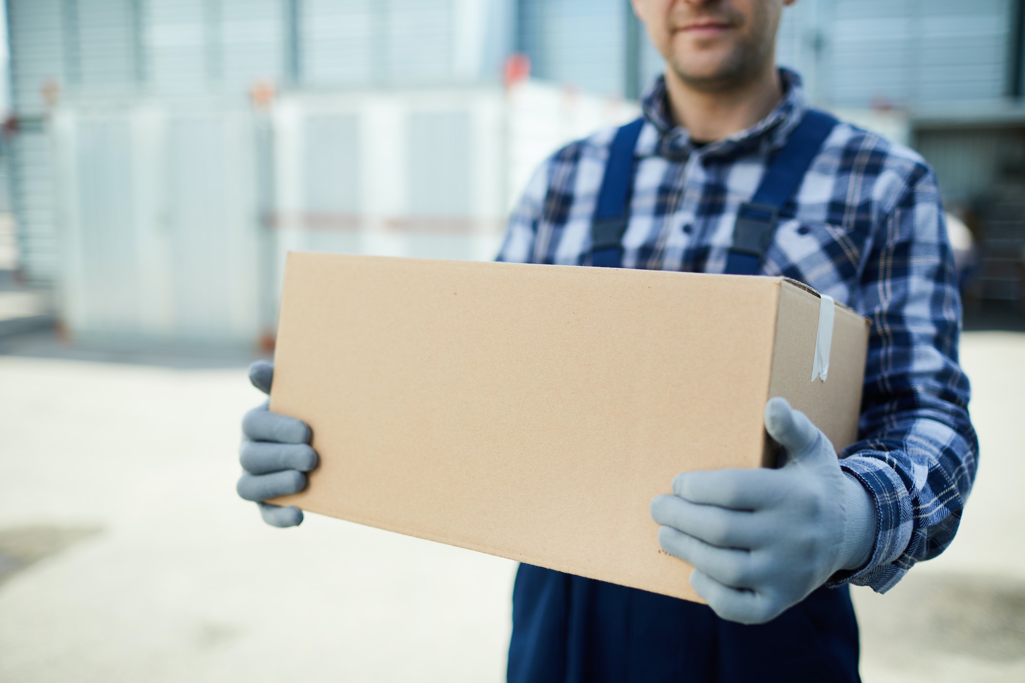 Moving company worker with box